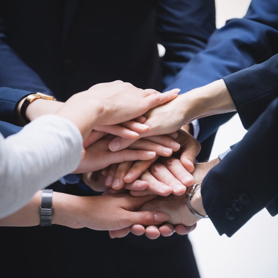 close-up of hands stack of business people